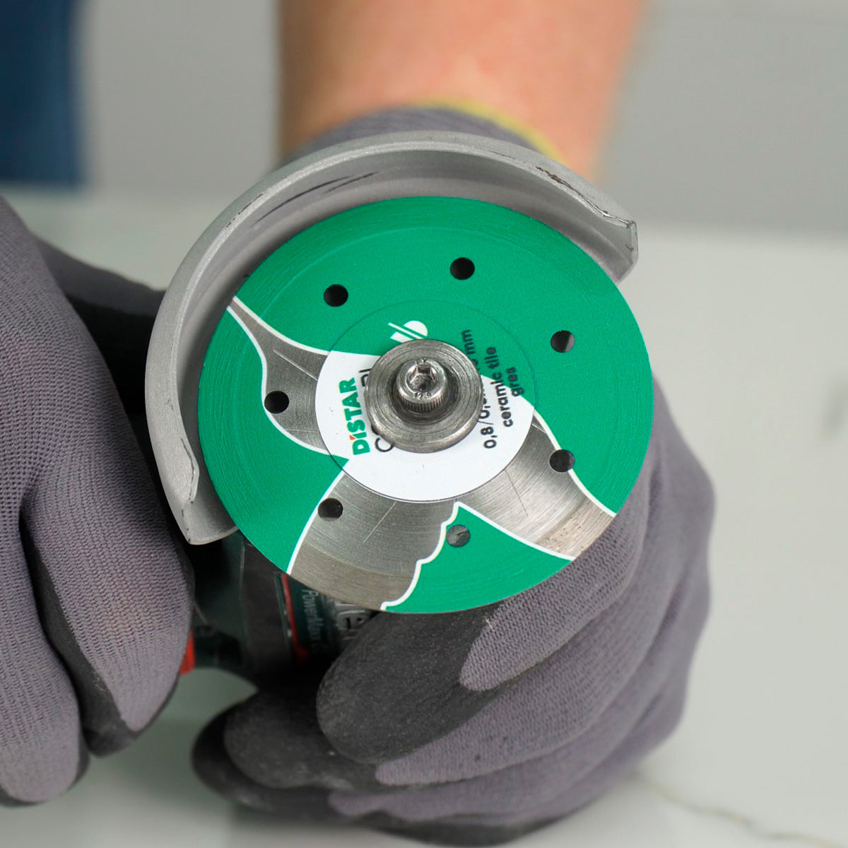 Distar COLIBRI diamond cutting blade mounted on angle grinder for tile cutting