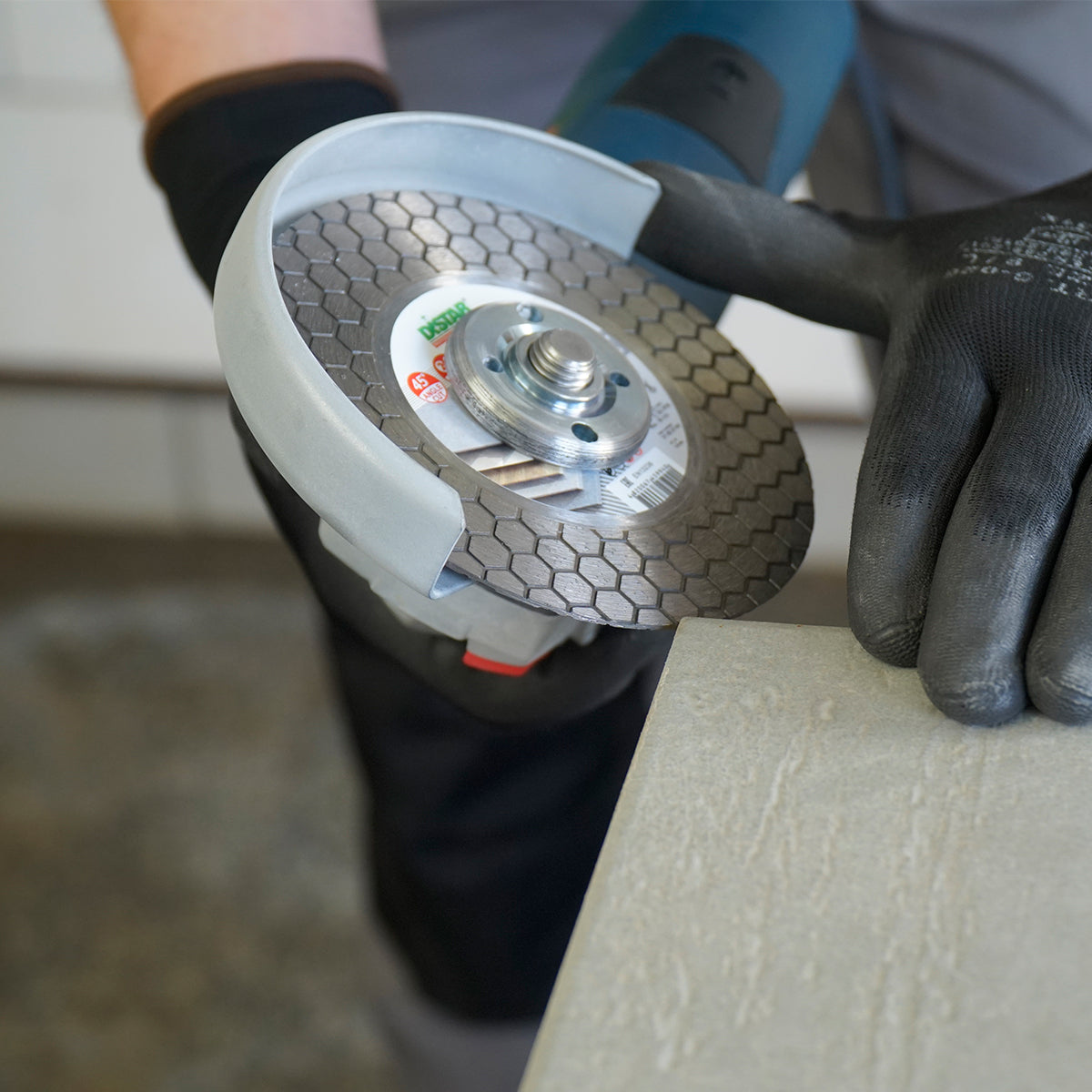 Professional dry cutting of porcelain tile with Distar EDGE DRY blade 125 mm